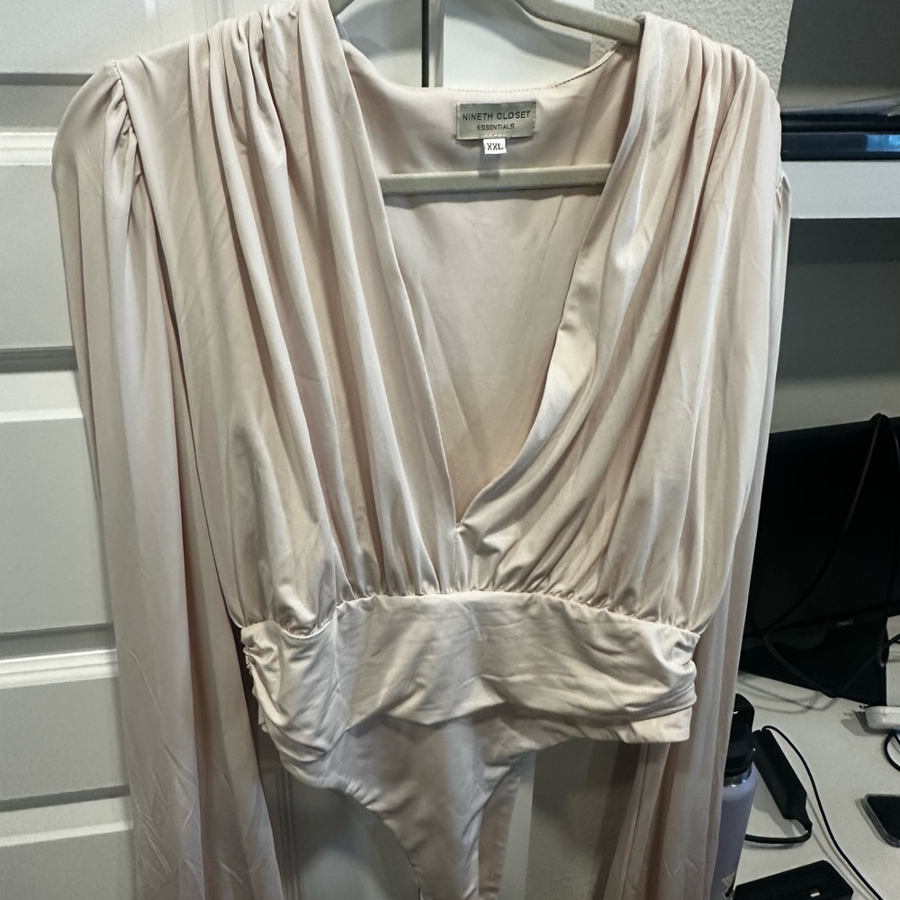 Cream Bodysuit with Plunging V-Neckline and Long Sleeves
